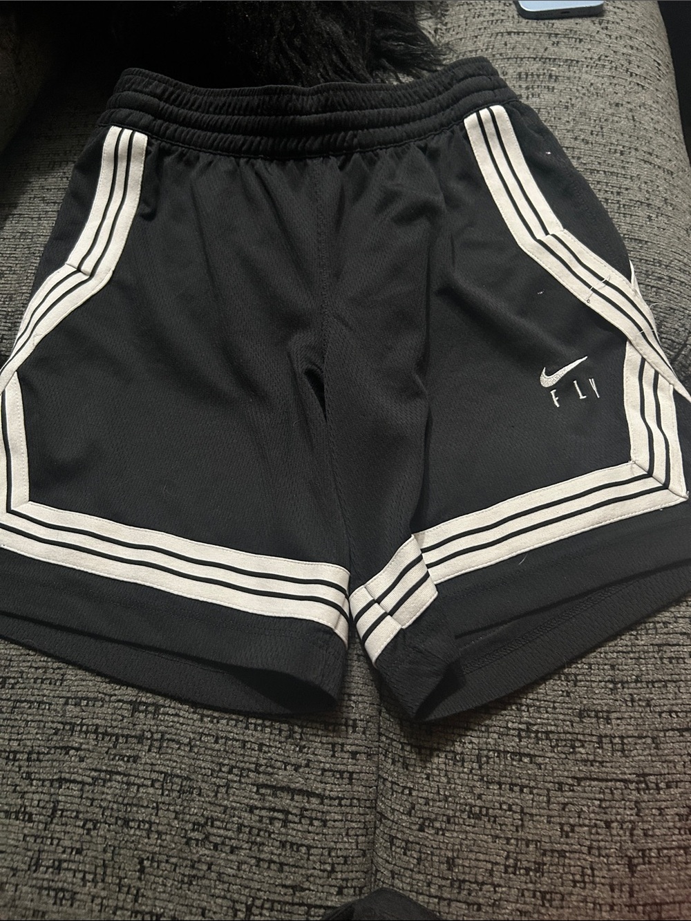 Nike kids Black basketball Shorts with White Trim and Swoosh